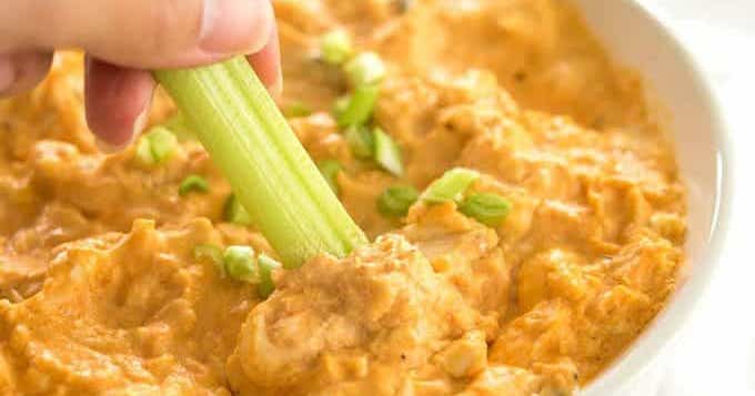 If you love buffalo chicken wings, then this buffalo chicken dip is for you! Shredded chicken is mixed with cream cheese, hot sauce, ranch dressing, and topped off with cheese and served hot and melty. Only 5 ingredients and you’ve got a winning appetizer perfect for tailgate parties, backyard get-togethers, and more.