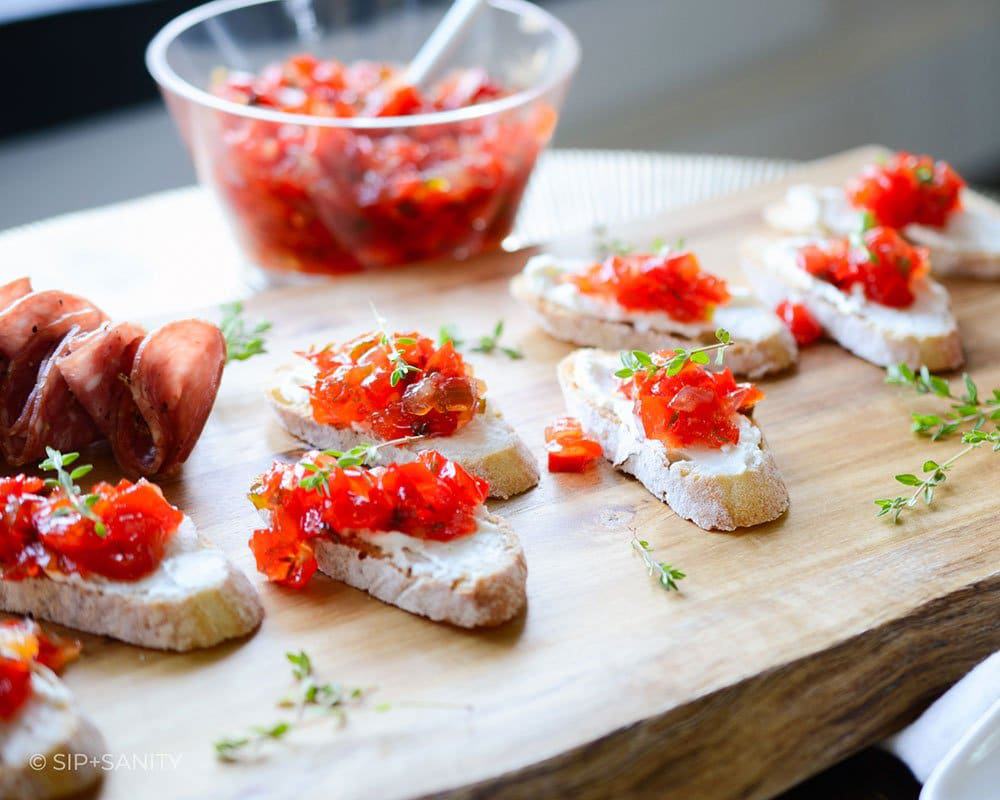 Serve Red Pepper Jam Goat Cheese Crostini at your next gathering and watch your guests keep going back for more. There is nothing better than tangy, pungent goat cheese contrasted with this sticky, sweet, and a tad spicy, jam.