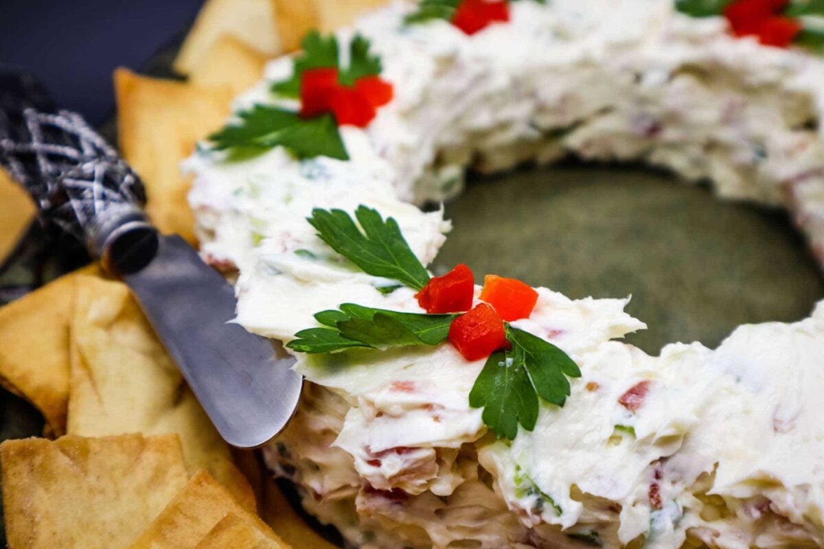 The proverbial Christmas cheese ball is now a savory holiday masterpiece, a Bacon Scallion Cheese Wreath. It's flavorful, kind of cute, and it makes about 3 cups which will round out the food table in a room full of party-goers.