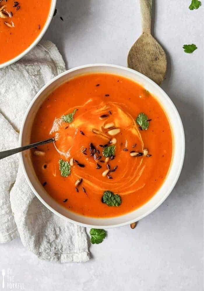 Creamy roasted red pepper and butternut squash soup made with minimal ingredients and finished with a kick of chili and toasted cumin seeds for extra flavor!