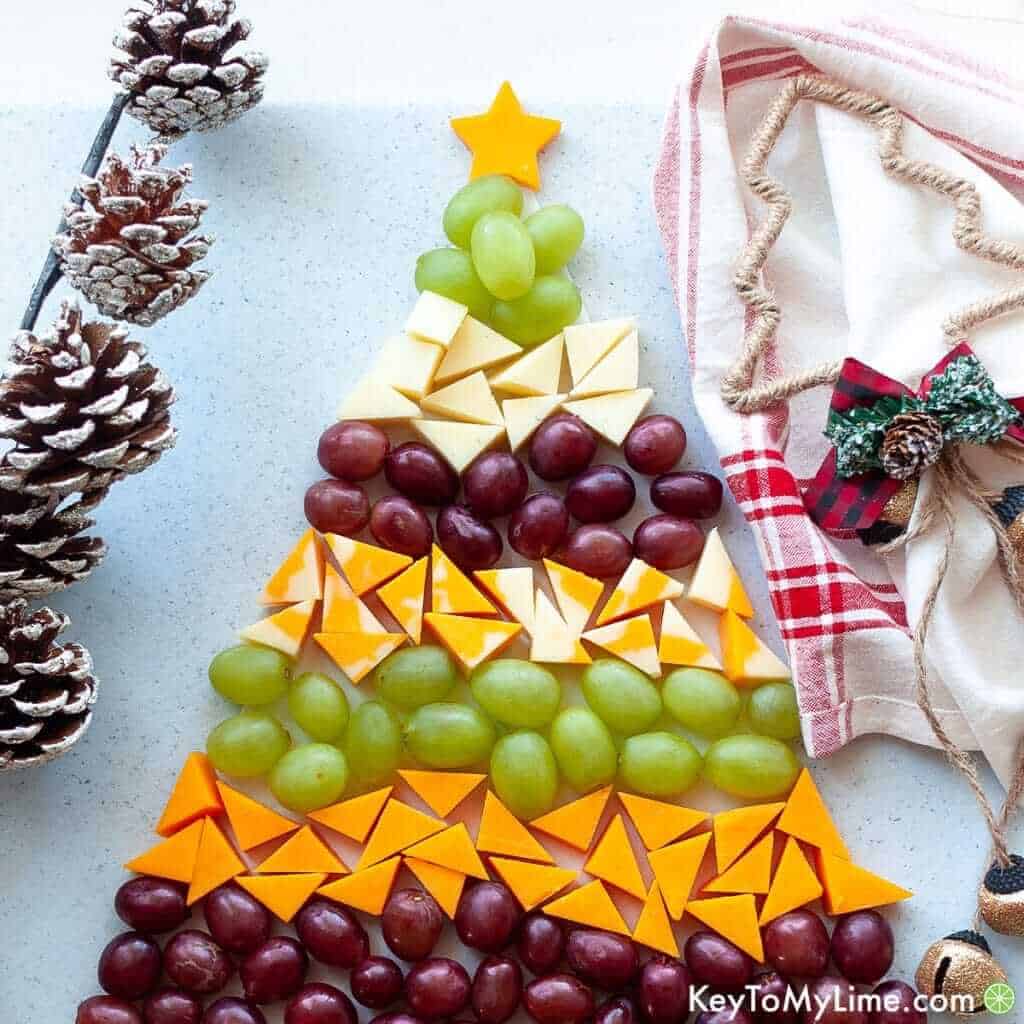 This Christmas tree cheese platter is the perfect no-bake holiday appetizer! It’s festive, delicious, and easy for anyone to make. It’s a great recipe to make with kids, too!