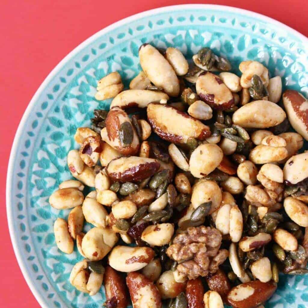 These Candied Nuts are salty-sweet, perfectly crunchy, insanely moreish and satisfying. They’re super easy as they take less than 10 minutes to make, are made using basic ingredients and are made in a frying pan (not the oven). They’re vegan, gluten-free, refined sugar-free optional, not too sweet, a good source of protein and fiber and are much healthier than the shop-bought version.