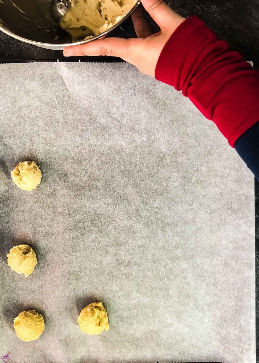 Scoop the cookies onto the prepped baking tray.