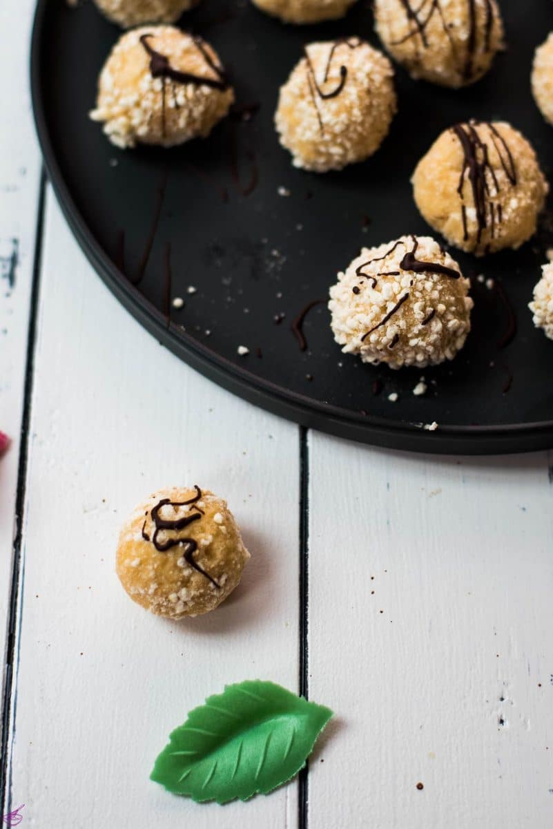 Gorgeous mascarpone eggnog cookie, rolled in ladyfinger crumbs and drizzled with chocolate sauce.