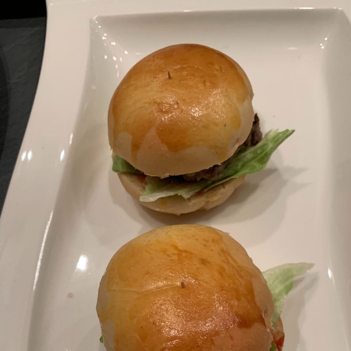 Homemade patties and buns assembled into perfect mini cheeseburgers.