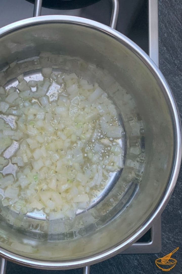 Heat the butter and sauté the onion until translucent.