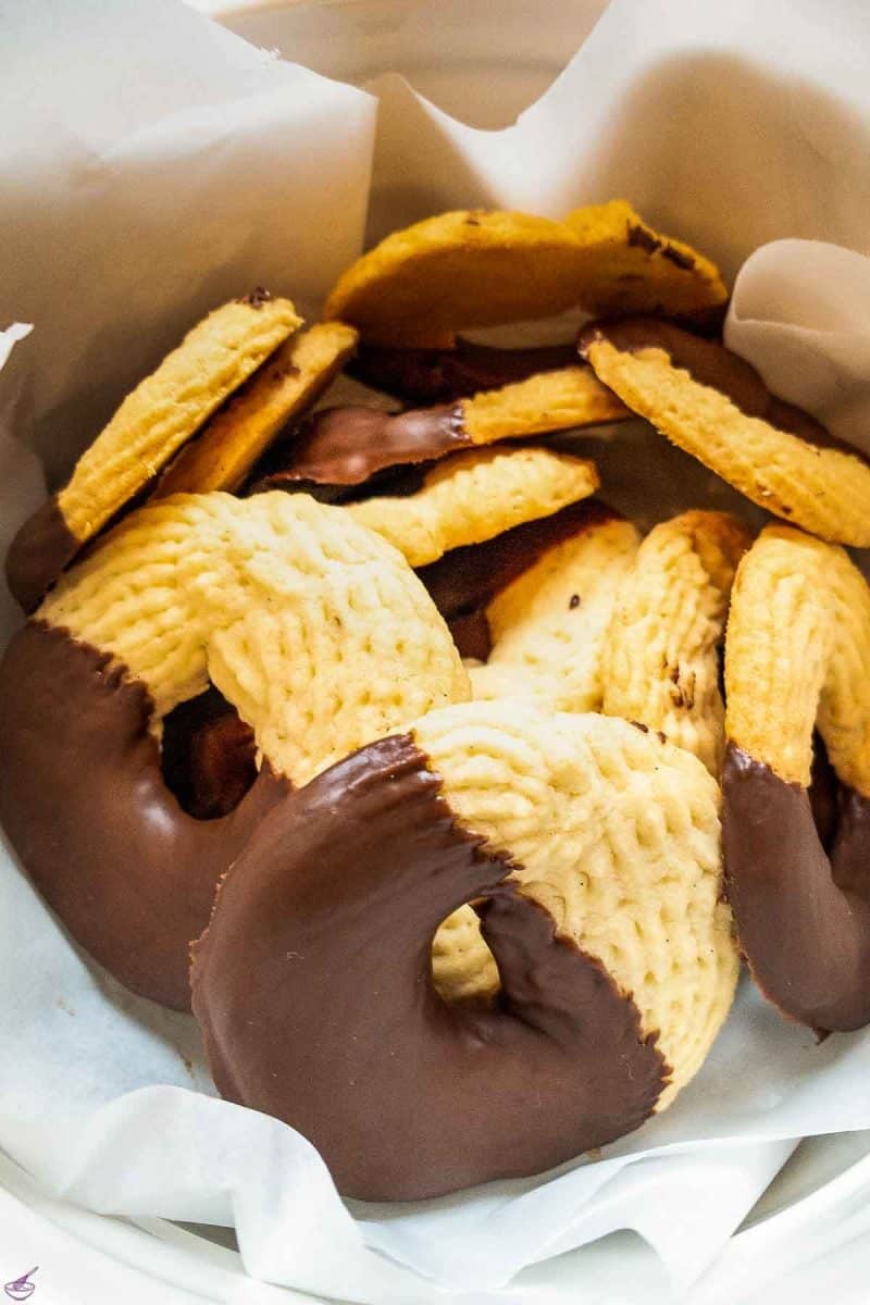 Ready to eat chocolate dipped butter cookies in cookie jar.