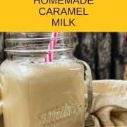 Drinking glass with plastic straw and ready to drink caramel milk. Beige linen in the back.