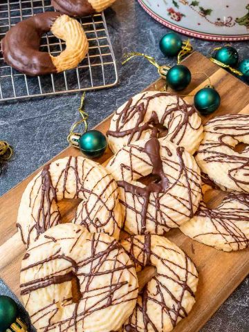 Chocolate drizzled and chocolate dipped butter cookies ready to eat.