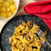 Garnish shredded pancakes with powdered sugar and serve with apple compote.