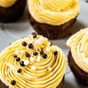 Boozy Baileys Salted Caramel Cupcakes with a delicious chocolate Sponge! Sprinkled with chocolate balls and caramel crunch.