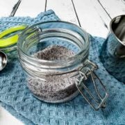 Preserving jar filled with a mix of granulated sugar and vanilla powder.