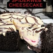 Slice of no bake raspberry Oreo cheesecake on a black plate.