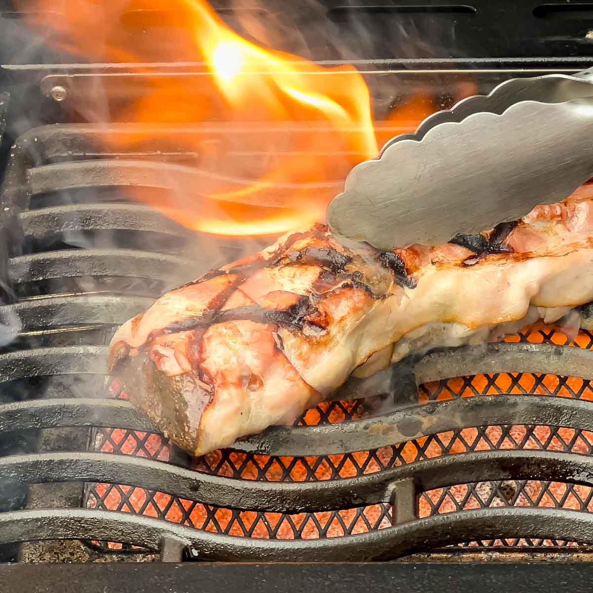 Venison loin wrapped in bacon seared on the sizzle zone.