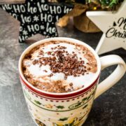 Hot chocolate topped with milk foam and chocolate sprinkles.