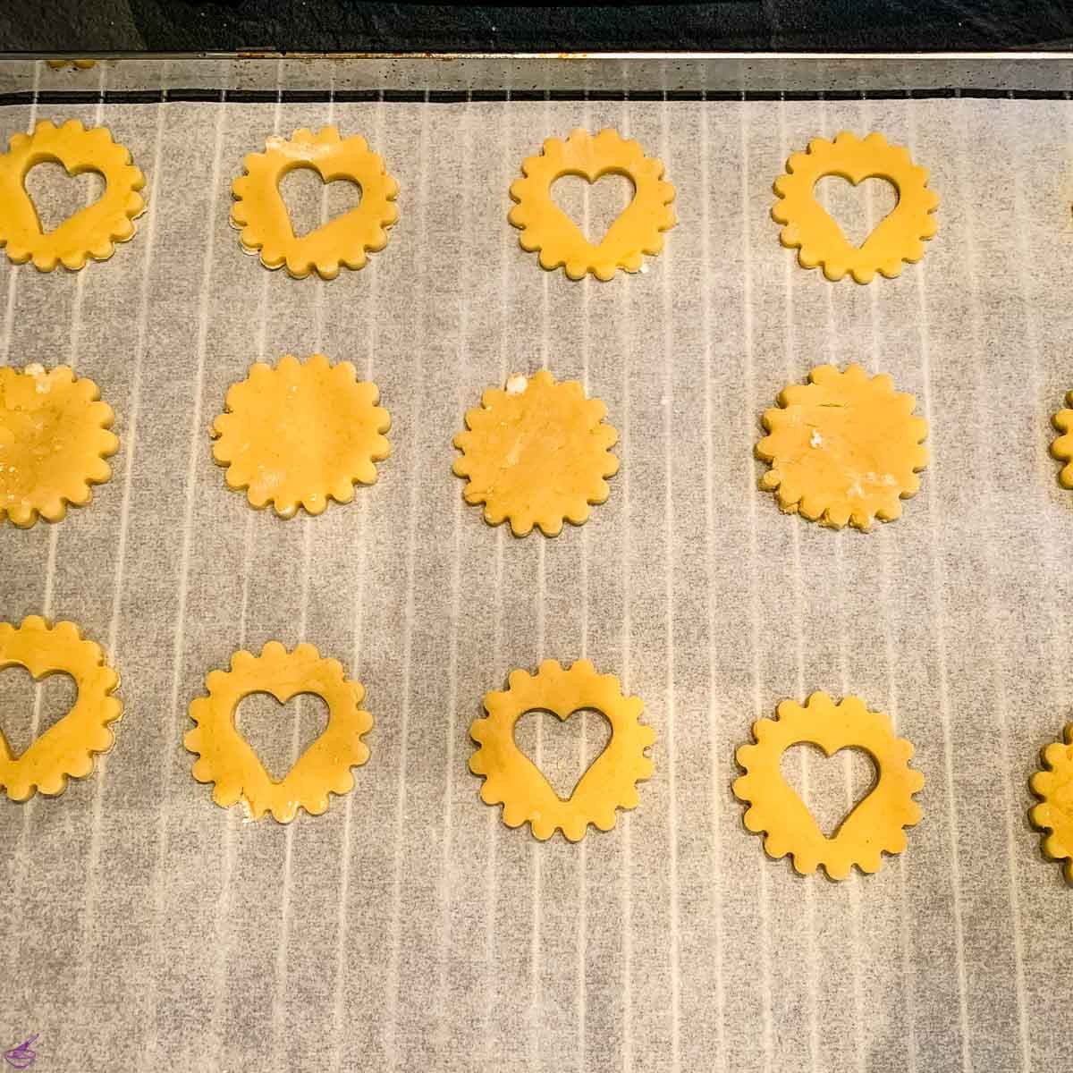 Place the cut out cookies on the baking tray lined with baking paper.