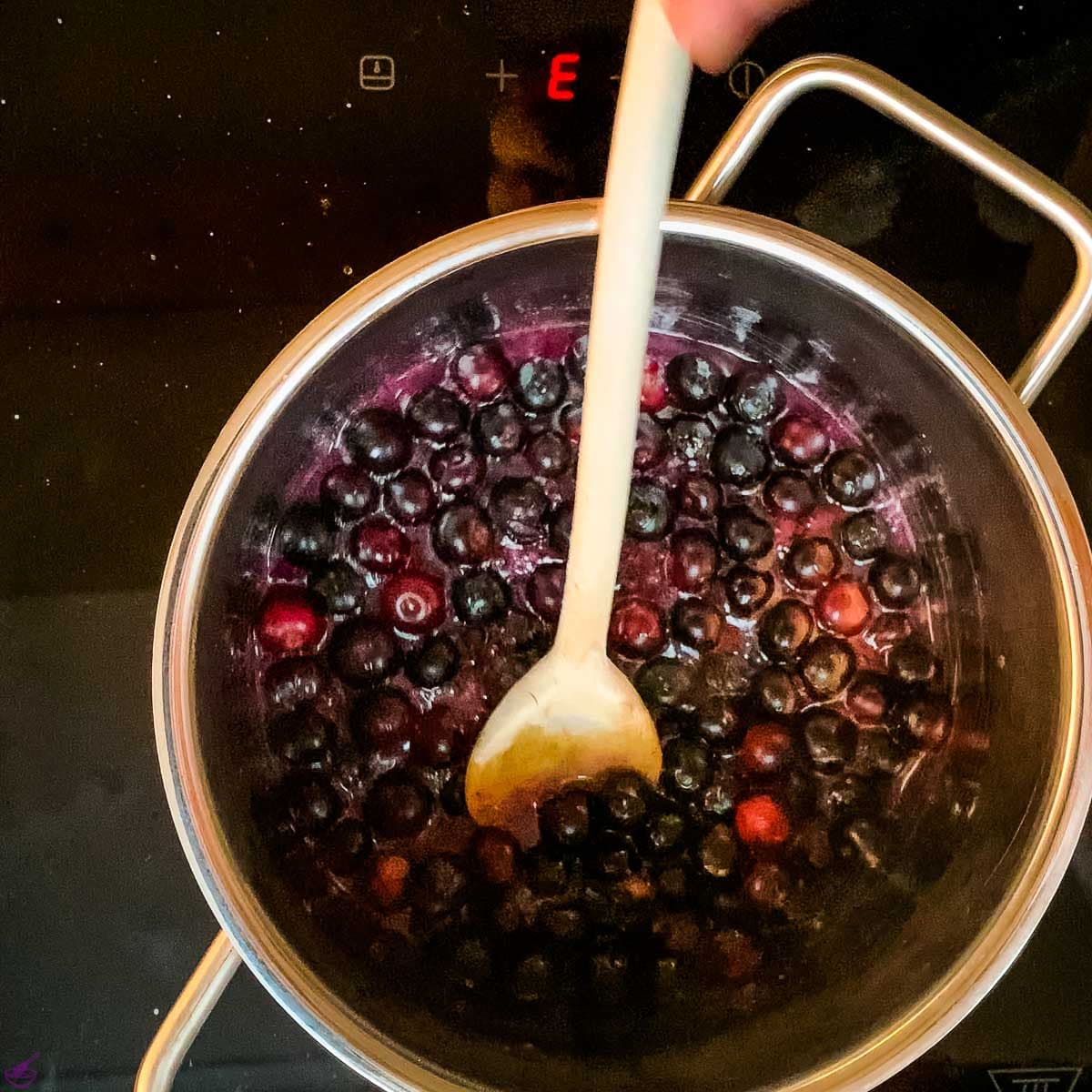 Preparing the blueberry sauce.