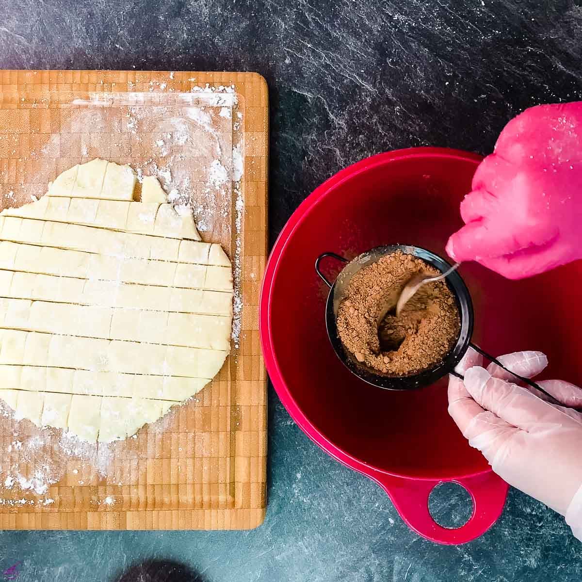 Sieve the cocoa in a bowl.