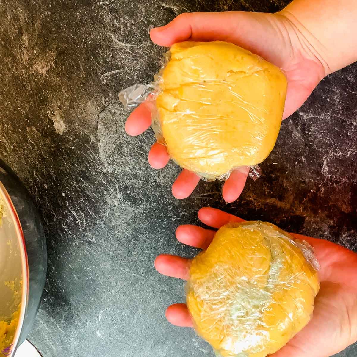 Cut the dough in half and wrap each in cling film.