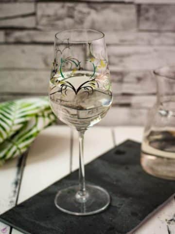 A gorgeous glass filled with a refreshing white wine spritzer! Enjoy!