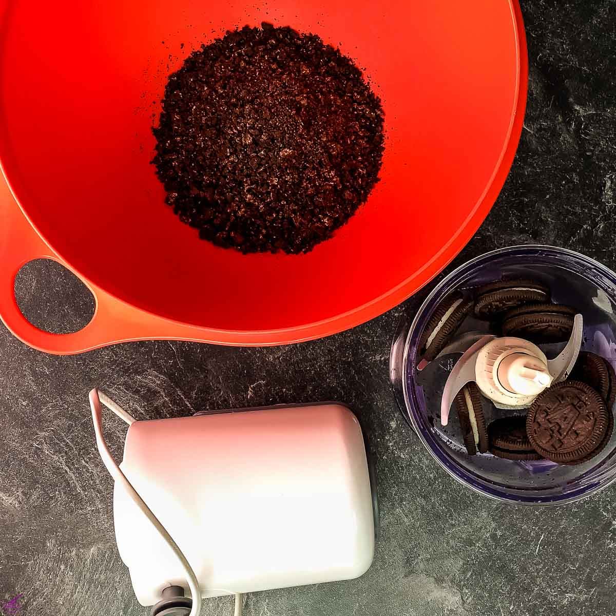 Crush the Oreo cookies using an electric chopper.