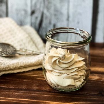 A Weck glass filled with strawberry flavored whipped cream.