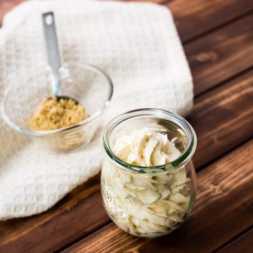 Almond whipped cream piped in a gorgeous Weck Jar on a wooden ground.