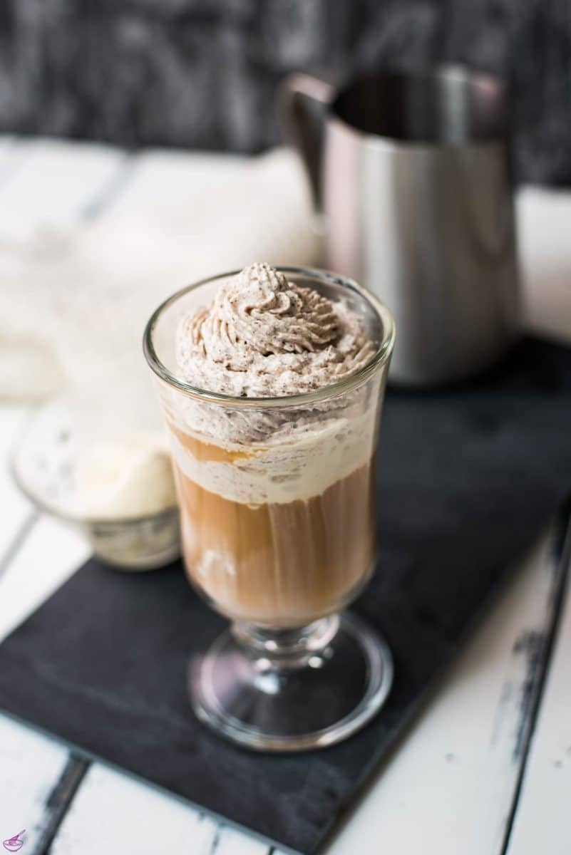 Beautiful glass filled with delicious vanilla iced coffee. Topped with chocolate-flavored whipped cream.