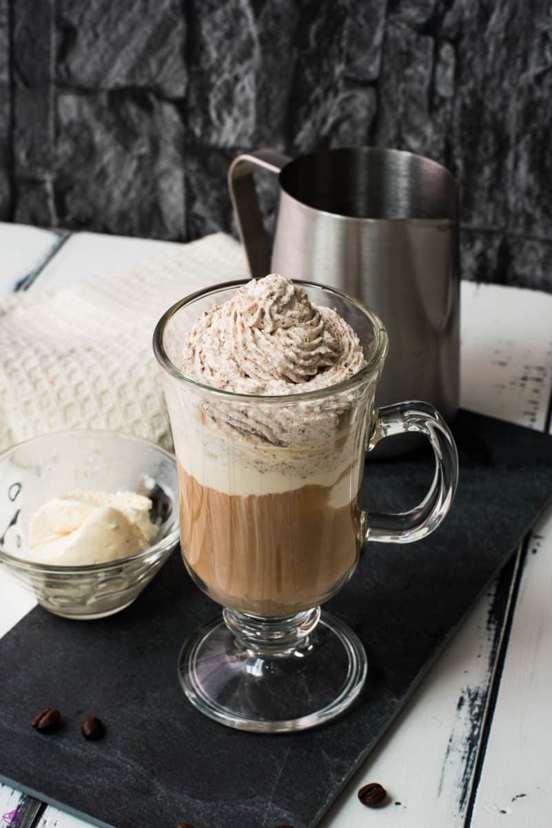 Beautiful glass filled with delicious vanilla iced coffee. Topped with chocolate-flavored whipped cream.