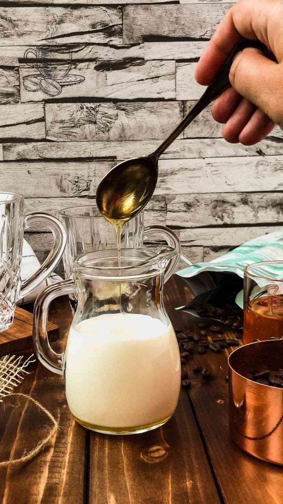 Add honey to the warm milk.