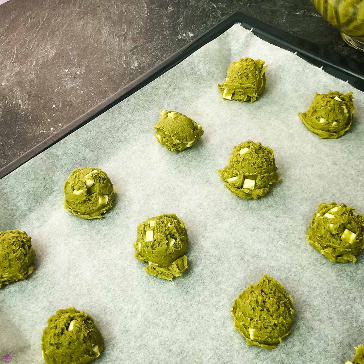 Scooped Matcha dough balls before baking.