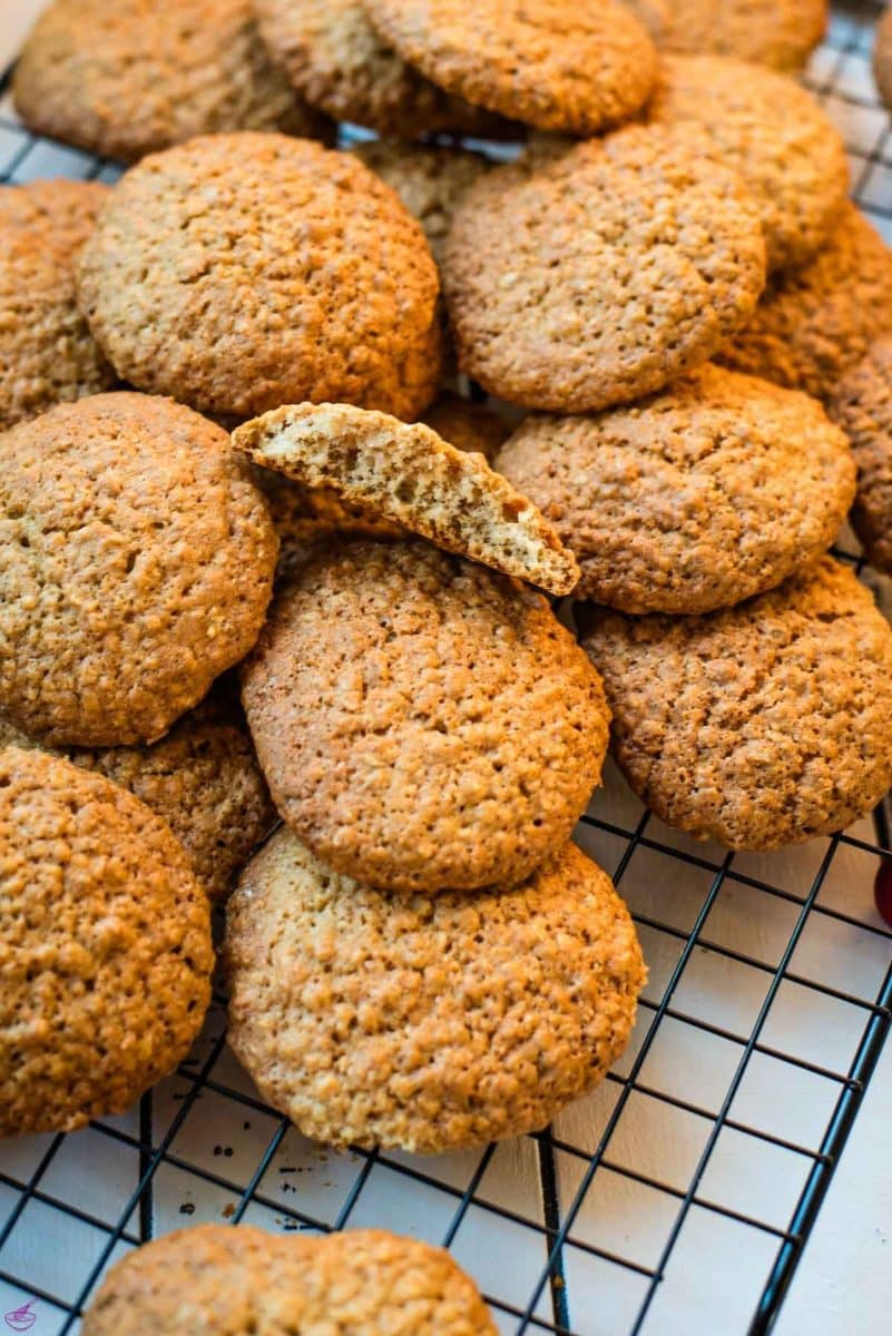 Oatmeal cinnamon cookies placed on cooling rack.