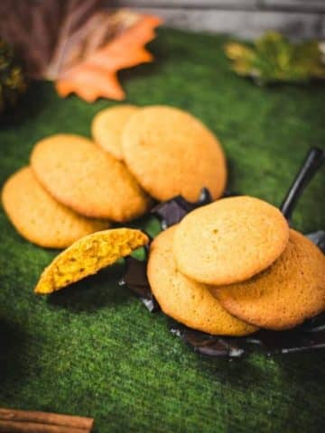 Super soft and delicious pumpkin cookies placed on black leaf shaped dish.