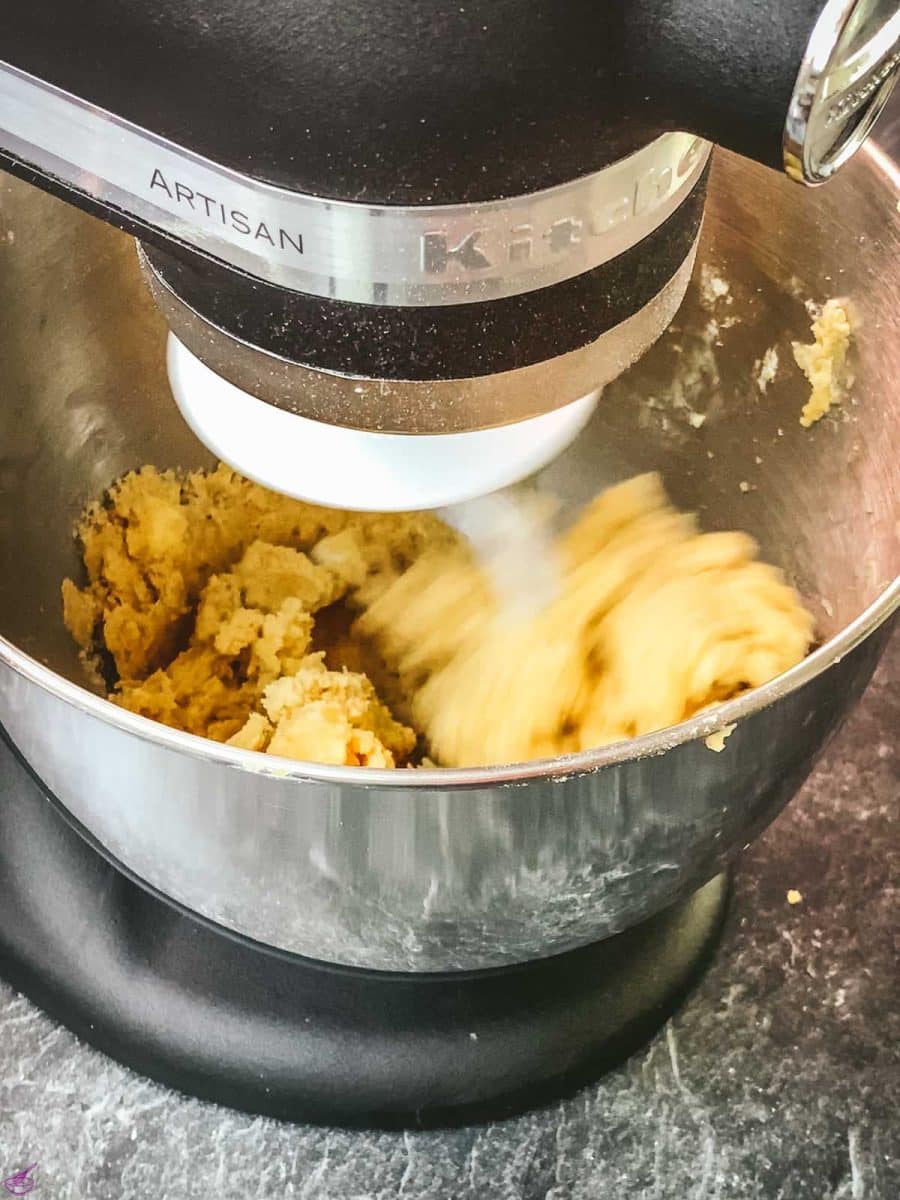 Either mix the dough by hand or with a stand mixer, attached with a dough hook.