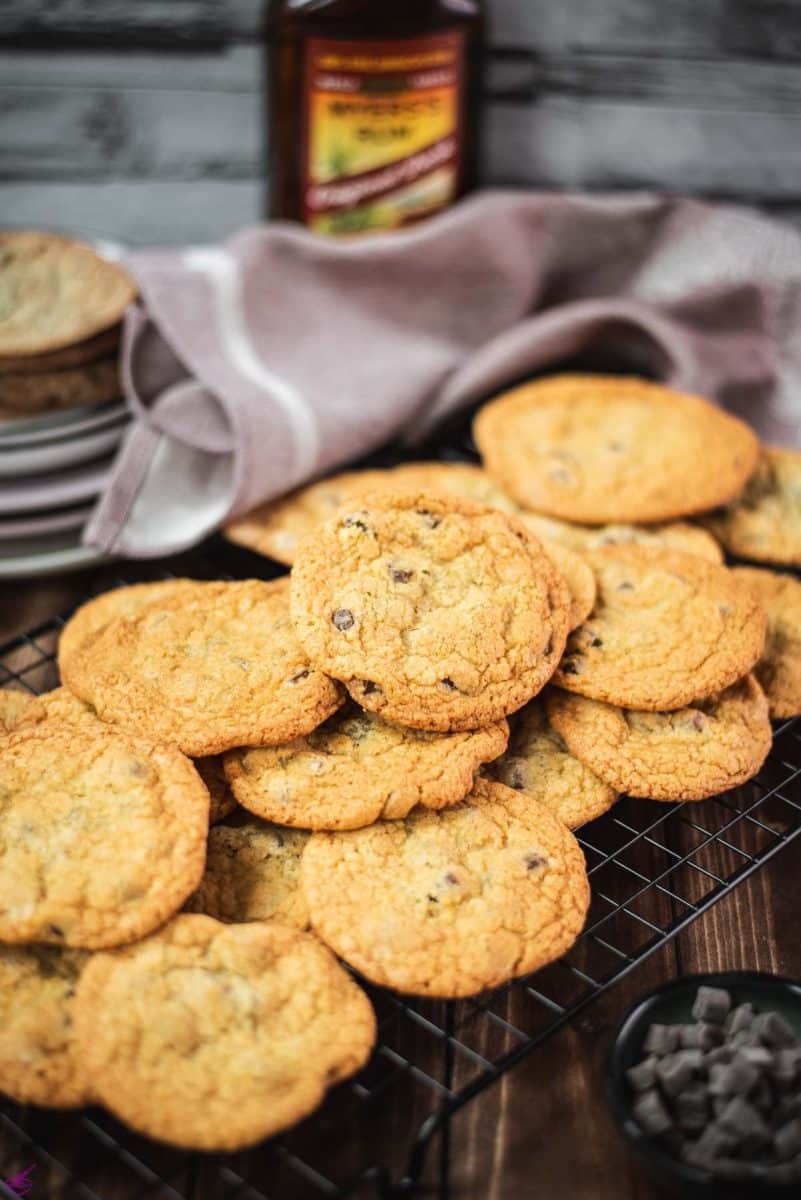 Delicious rum chocolate chip cookies placed on a cooling rack.