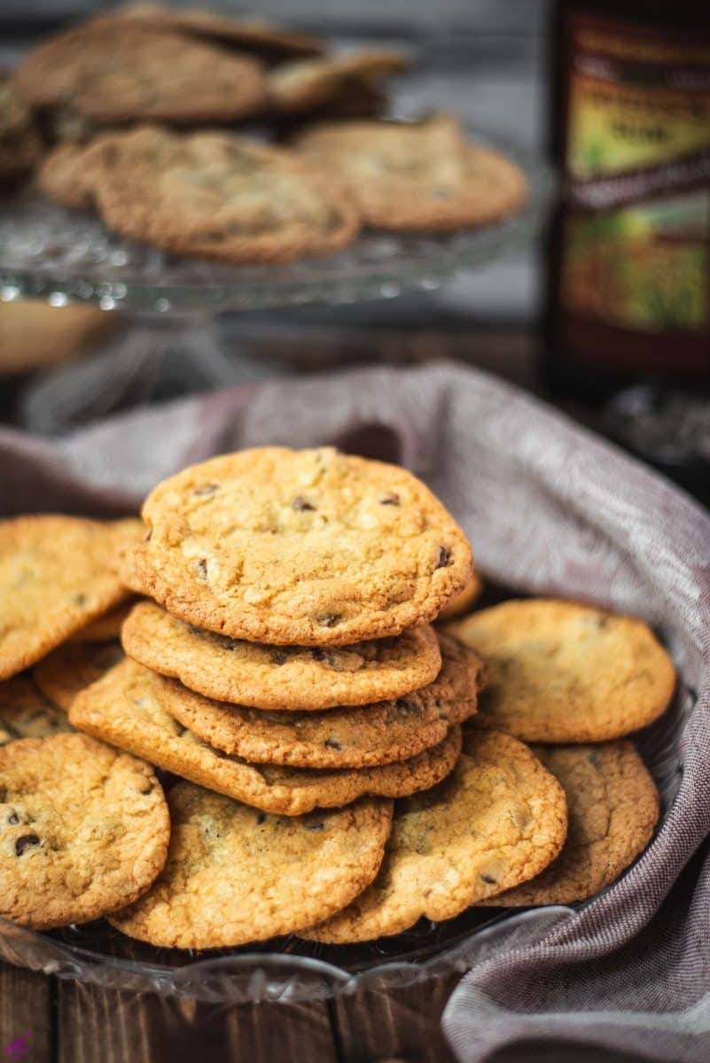 Delicious rum chocolate chip cookies placed on a glass plate.