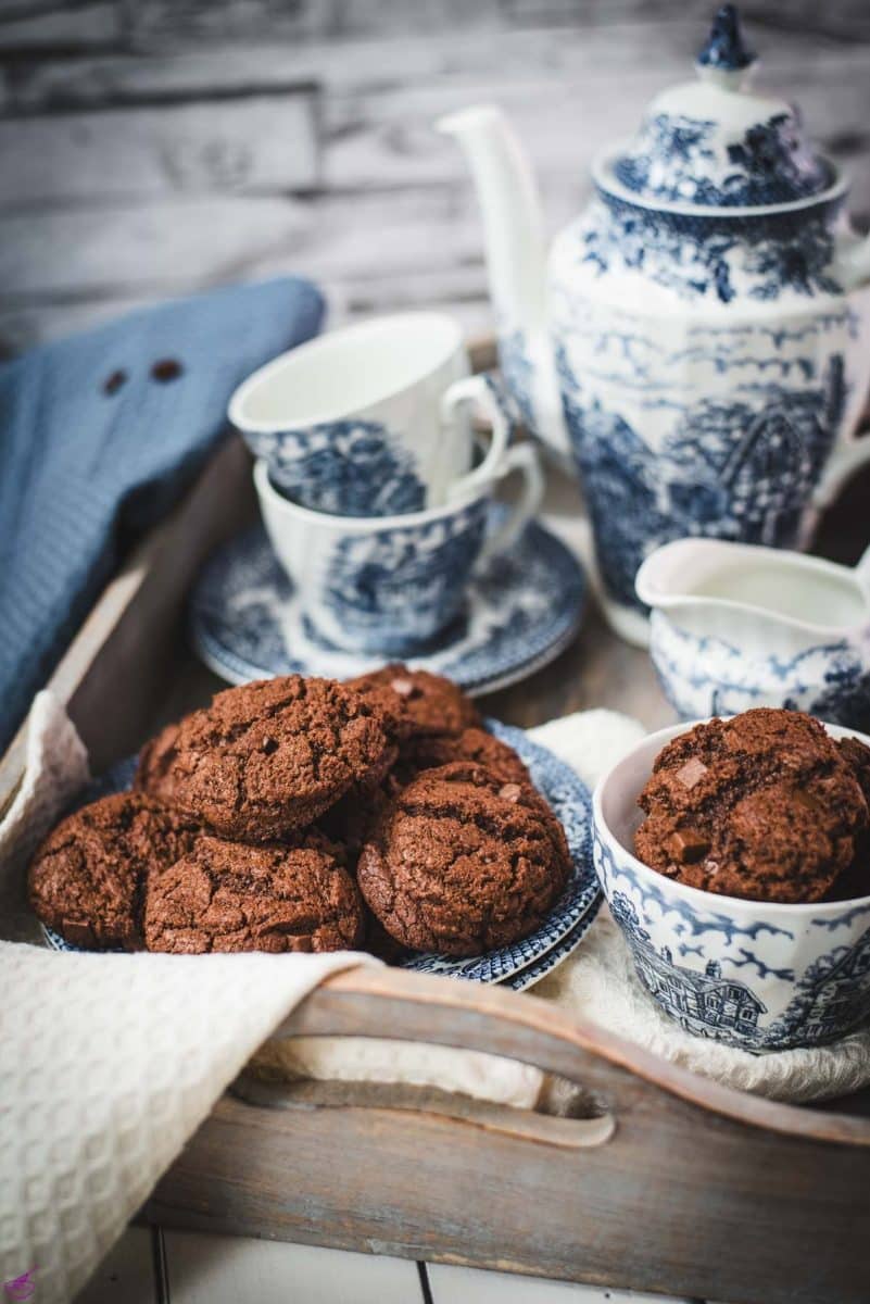 Beautiful coffee chocolate chip cookies, on blue white porcelain.