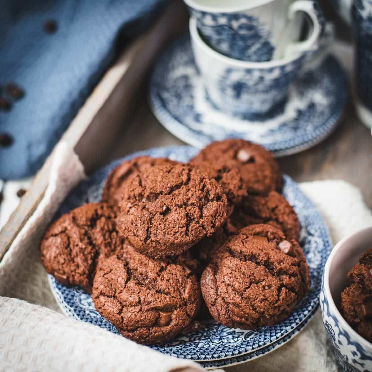 Beautiful coffee chocolate chip cookies, on blue white porcelain.