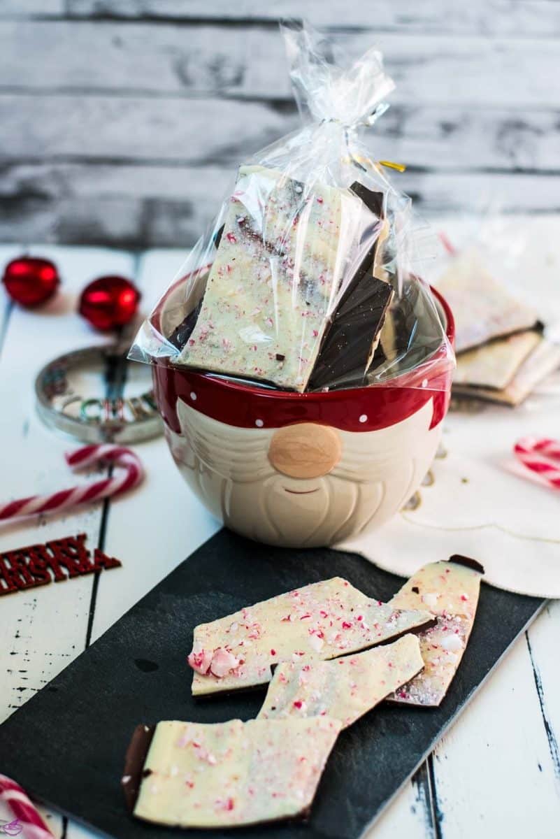 Beautiful black and white peppermint chocolate bark sprinkled with crushed candy canes. Placed in little gift bags.