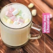 Glass cup filled with scrumptious white hot chocolate. Topped with frothed white chocolate and garnished with mini marshmallows.