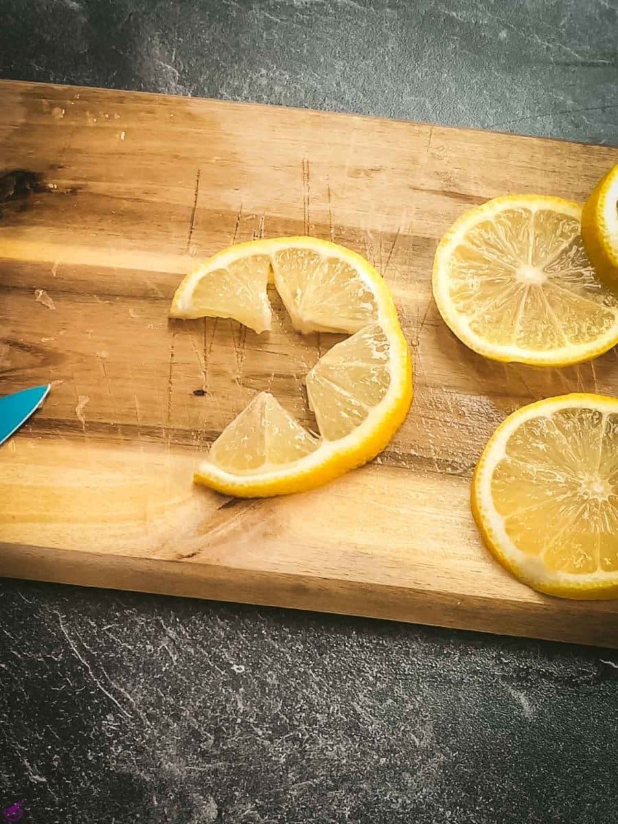 Cut into the lemon without cutting through.