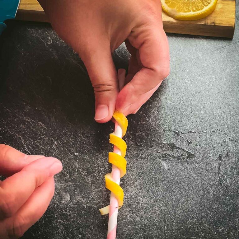 Finished lemon twist pinned on paper straw.