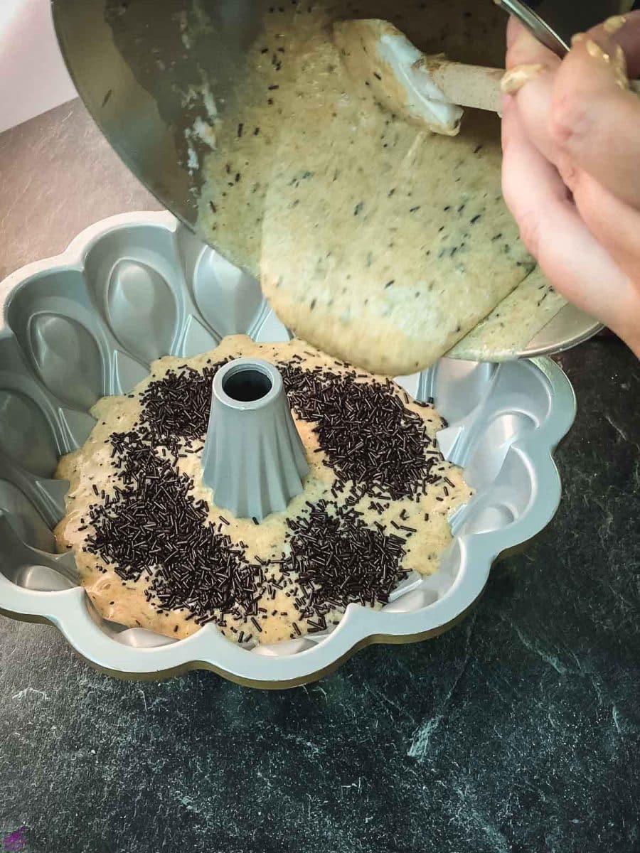 After adding a layer of chocolate sprinkles, add the remaining cake batter.