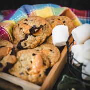 Ugly but delicious chocolate chip marshmallow cookies, placed on wooden tray plate.