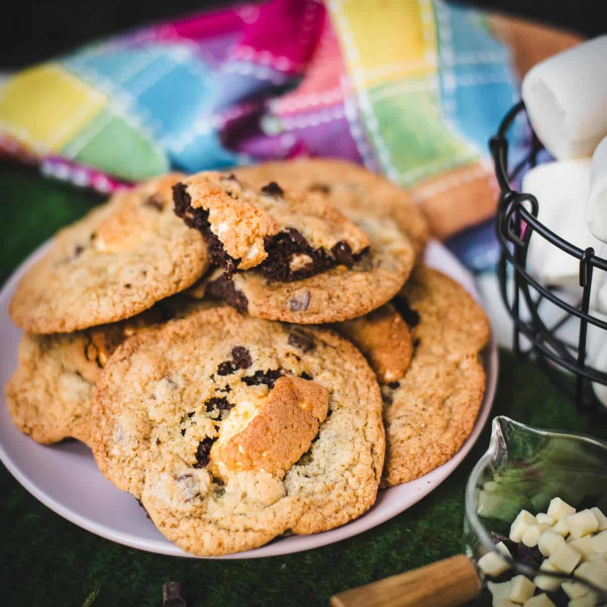 Ugly but delicious chocolate chip marshmallow cookies, placed on pink plate.