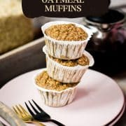 A magnificent tower of banana oatmeal muffins on a wooden tray. Behind it, delicious red tea.