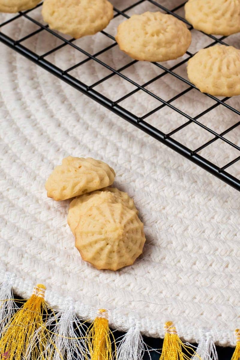 Three gorgeous mini lemon sugar cookies placed next to each other.