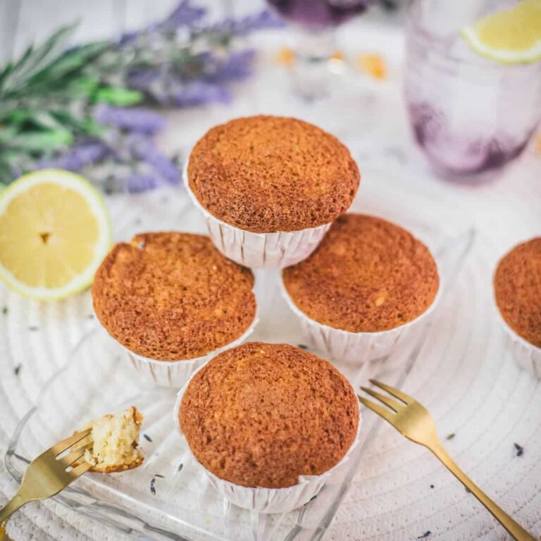 Delicious lavender lemon muffins, placed on glass tray.