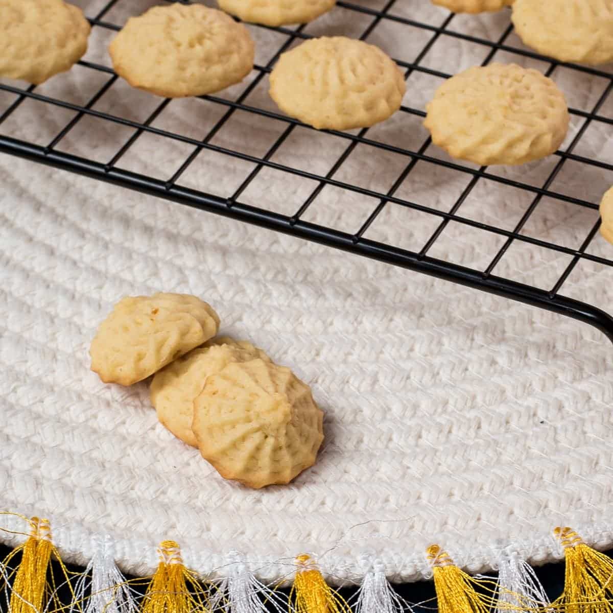 Three gorgeous mini lemon sugar cookies placed next to each other.