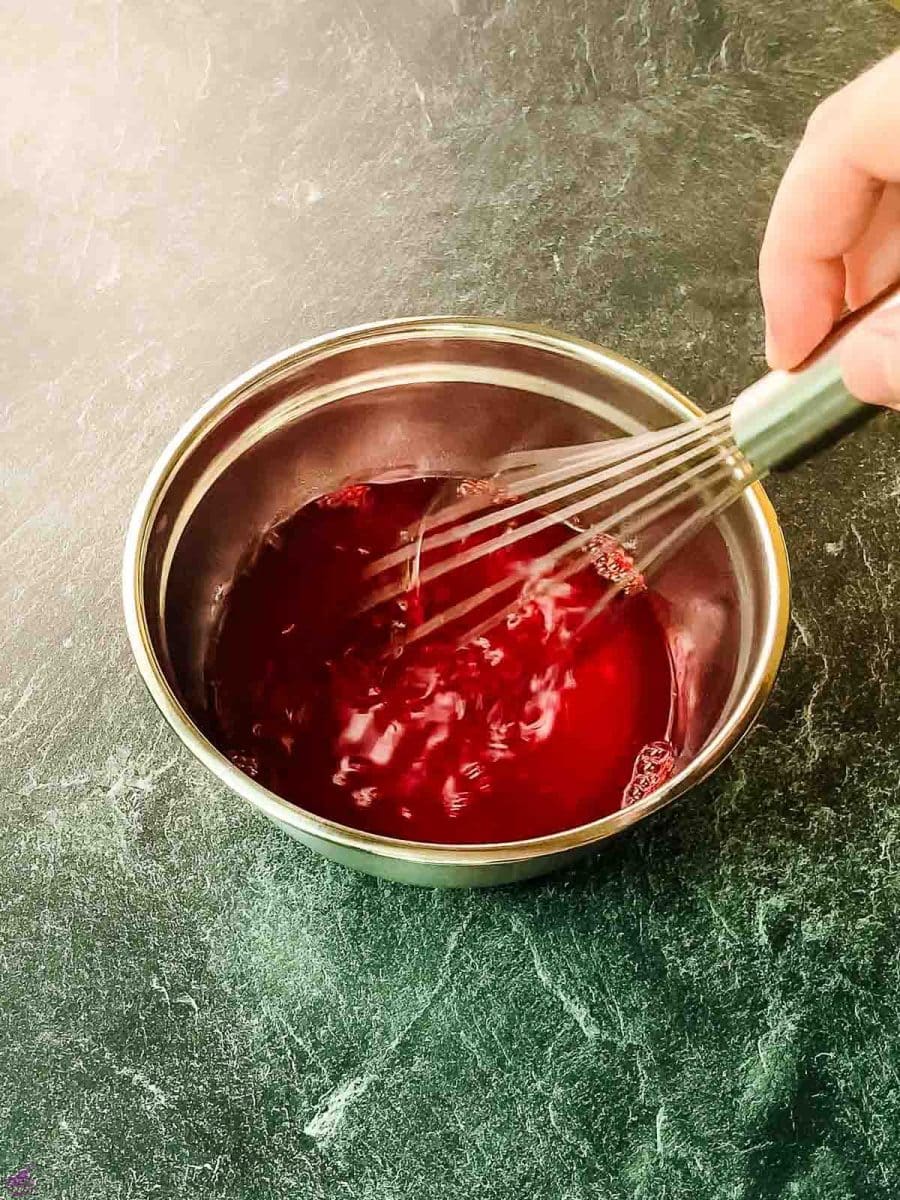 Mix the raspberry jello well with the boiling water.